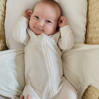 Baby in an Organic Cotton Babu Onesie