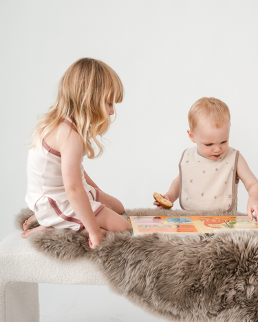 Children and babies playing wearing organic cotton kids clothing – GOTS certified summer styles – Babu