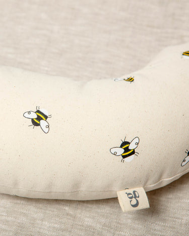 Made from a supportive wooden lining and a washable cotton cover with bees printed on it. The Bee tummy time support aid helps newborn babies during their floor time.