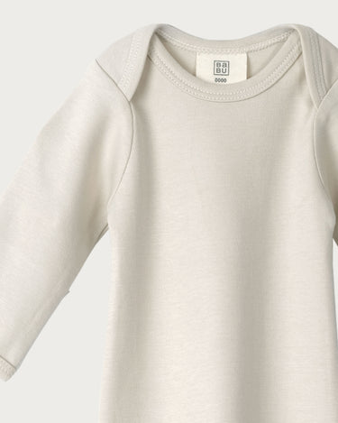 Organic cotton newborn sleepsuit in oat beige – GOTS certified – hospital bag essential baby gift – Babu - close up