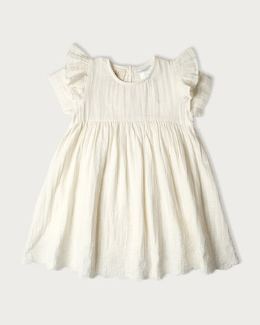 Organic cotton muslin short sleeve dress for girls in Vanilla cream – GOTS certified double gauze – embroidered scallop and ruffle detail – Babu - front