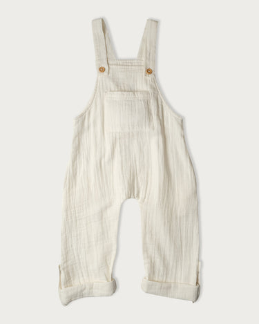 Organic cotton muslin overalls for babies, toddlers and kids in Vanilla cream – GOTS certified double gauze – adjustable straps and rolled cuffs – Babu - front