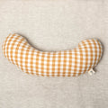 The Sonny Tummy Time support aid helps babies during floor time in their early months. Sewn in a mustard check cotton fabric.